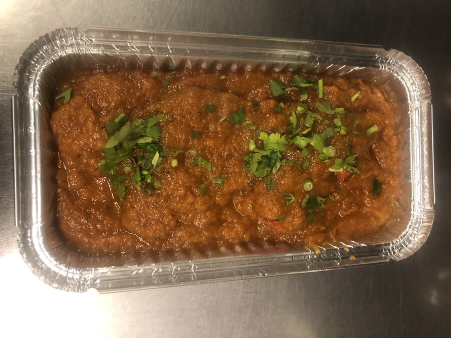 Simla signature curry, garnished with fresh coriander